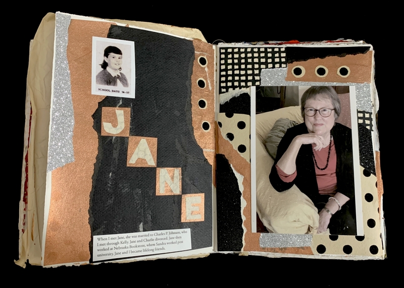Open scrapbook with photos of a young girl labeled "School Days '56 - '57" and an older woman, surrounded by artistic paper designs.