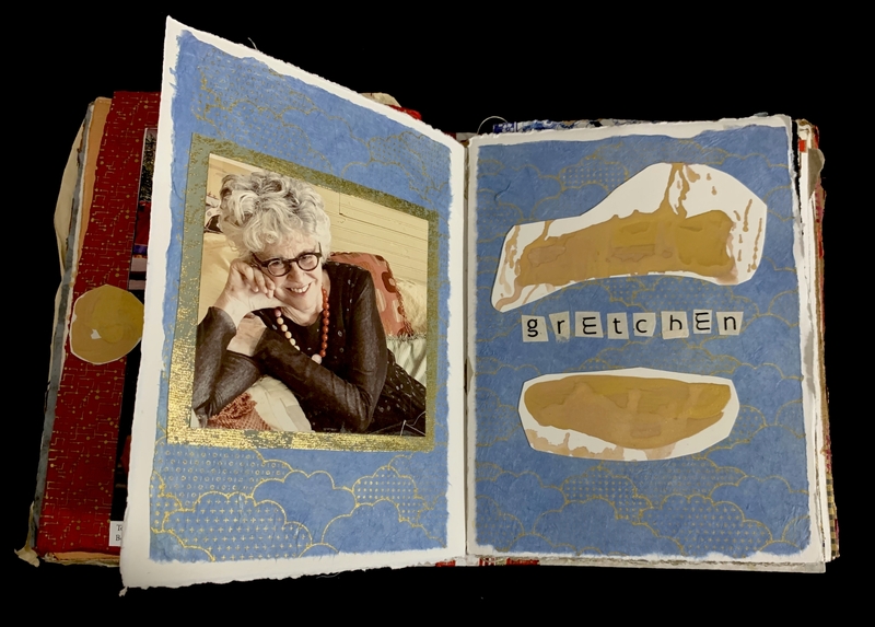Open scrapbook with a photo on the left page and abstract art with the name "gRetchen" on the right.