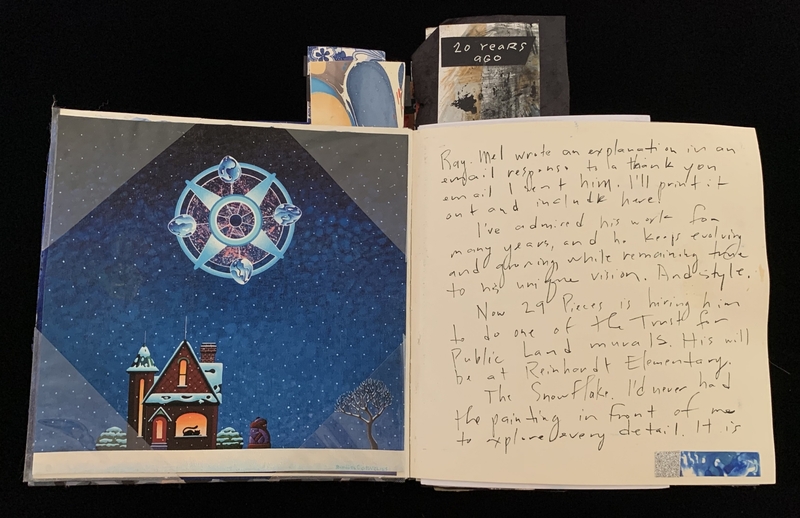 Open notebook with snowy house illustration on left and handwritten text on right.