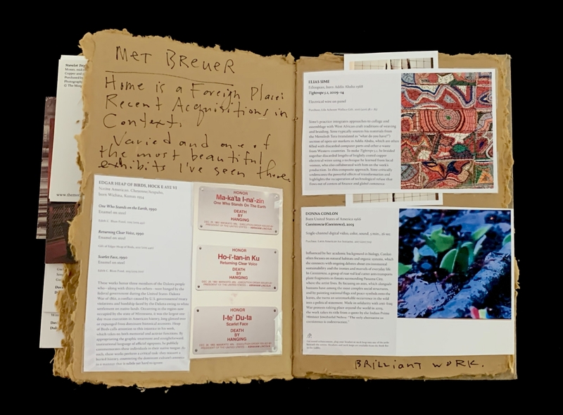 Exhibition catalog with artist profiles, abstract art, and handwritten notes.