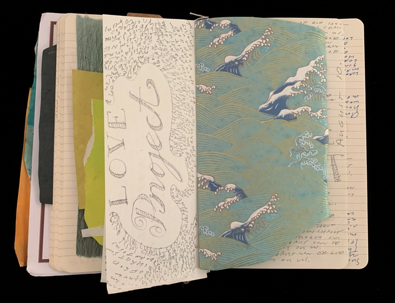 An open notebook with a "LOVE Project" page and stylized wave pattern.
