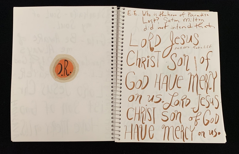 A handwritten page with religious text and a circular stamp.
