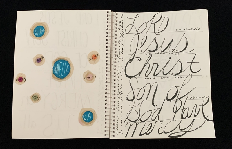 A page from a notebook featuring a mix of calligraphy and circular cutouts with handwritten text.