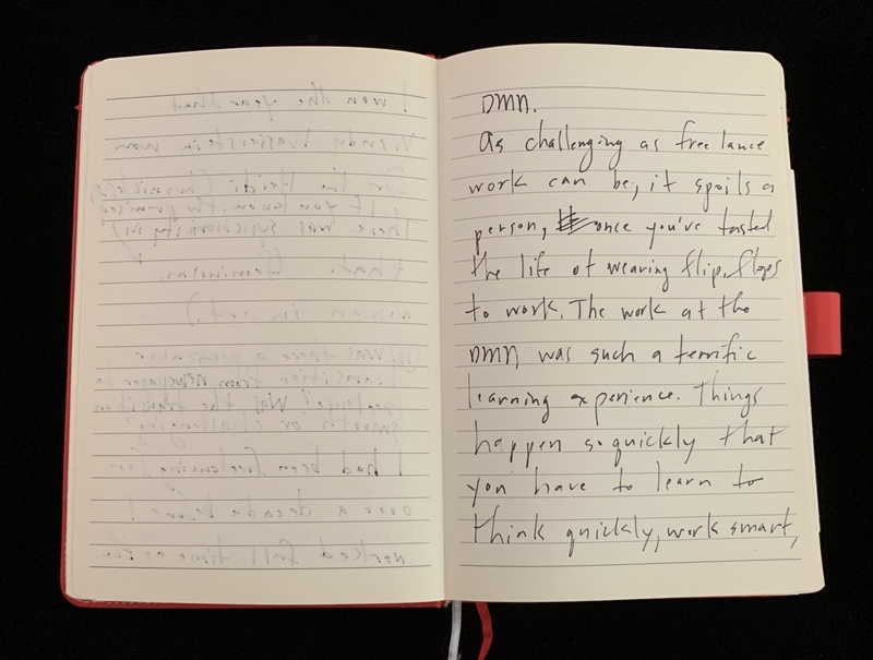 Open notebook with handwriting on lined pages.