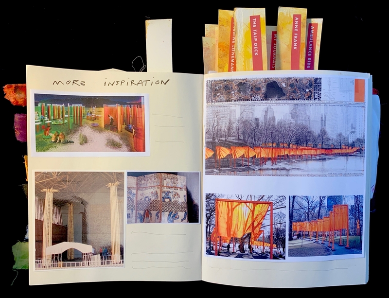 Open journal with photos of art installations and colorful tab markers.