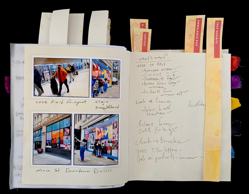 Open journal with photographs and handwritten notes, including a to-do list and colorful tabs.