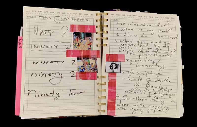 A notebook page with handwritten notes, images, and text related to personal work and creative projects.