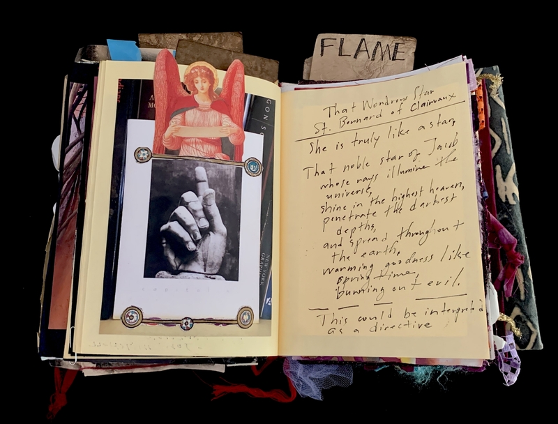 A scrapbook page featuring a photograph of a hand, an image of an angel, and handwritten text.
