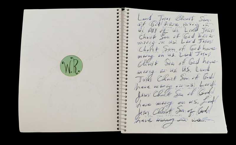 A handwritten page with a circular logo and repeated religious phrases.