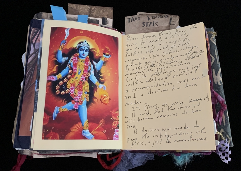 A scrapbook page featuring a vibrant illustration of a deity and handwritten notes.