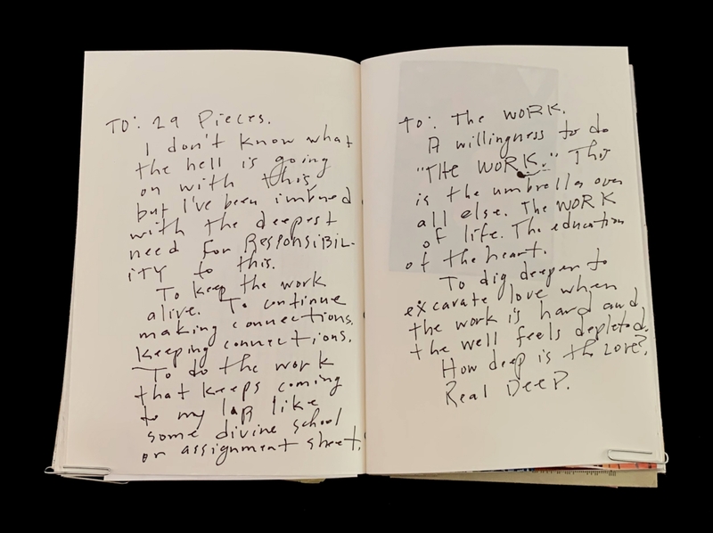 Open book with handwritten text on both pages.