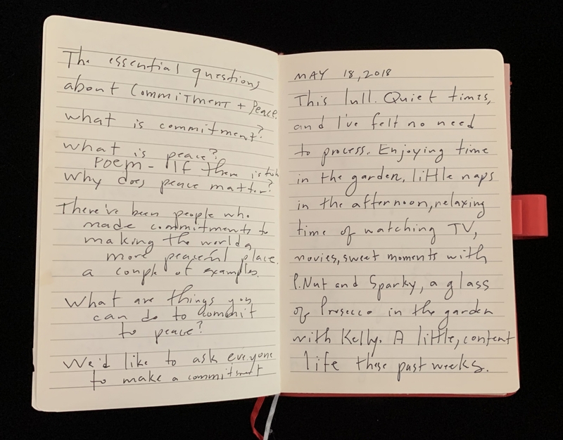 Open notebook with handwritten reflections on commitment, peace, and personal life, dated May 18, 2018.