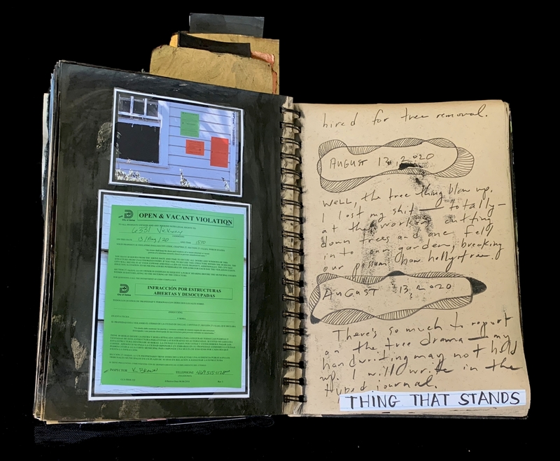 A journal page with handwritten notes, a photograph, and a document related to a property violation.