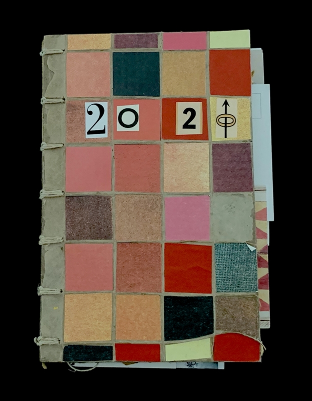 Grid-patterned notebook cover with colored squares and '202' displayed.