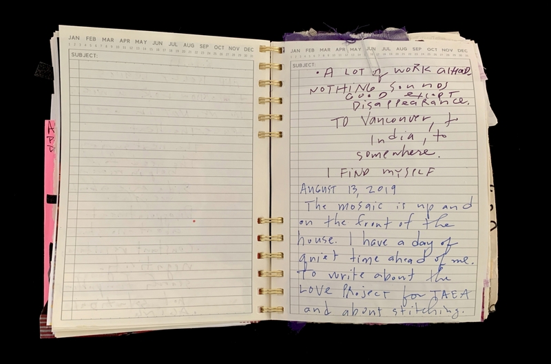 A handwritten entry in a spiral-bound notebook dated August 13, 2019, discussing work, travel, and a quiet day ahead.