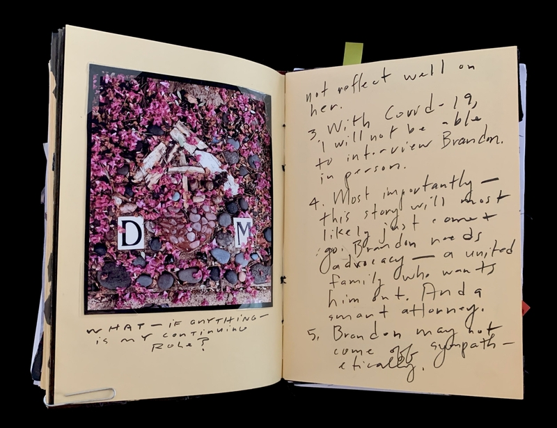 A handwritten page with a photograph of a stone arrangement and notes about a story and its challenges.