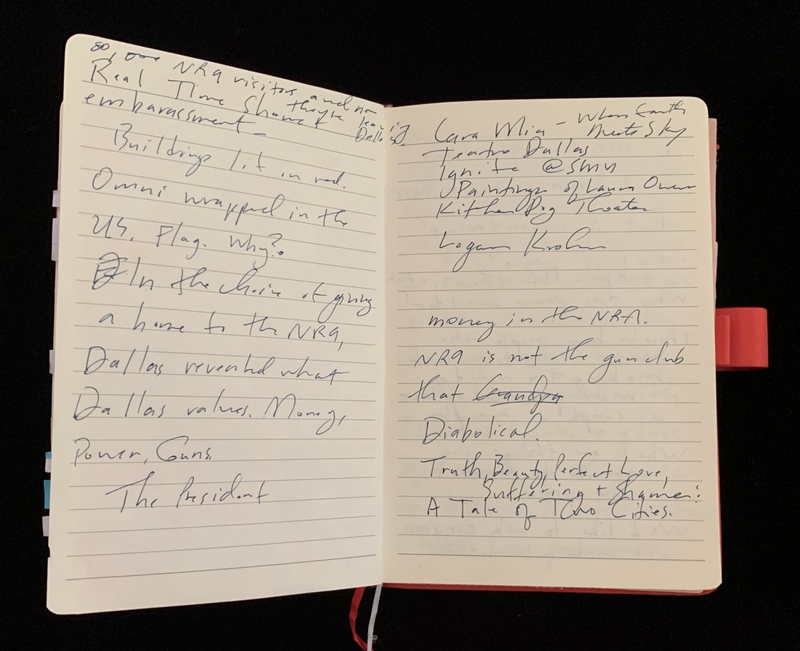 An open notebook with handwritten notes about the NRA and related topics on both pages.