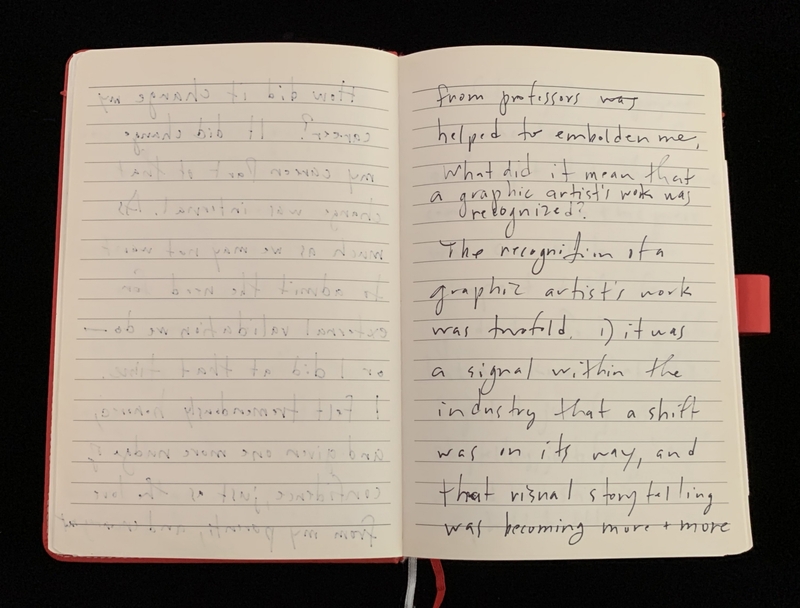 Open notebook with handwritten text against a black background.