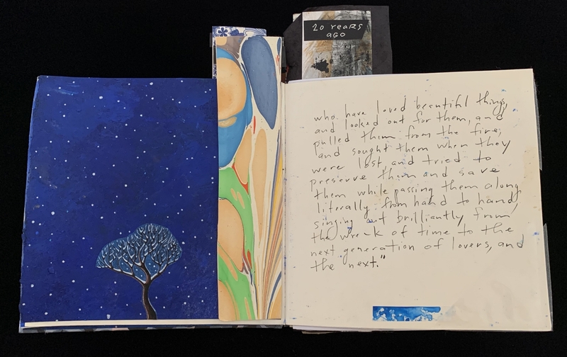 Open book with a starry night illustration on the left and handwritten text on the right.