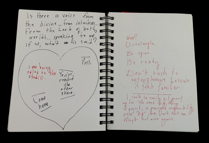 : A handwritten page with a heart diagram and reflective text about intuition and divine voices.