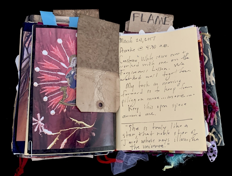 A scrapbook page featuring a handwritten note, a photograph, and a piece of paper labeled "FLAME."