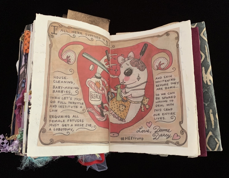 A satirical illustration and text page from a handmade book, featuring a cartoonish depiction of a fetus with household items and text criticizing gender roles.