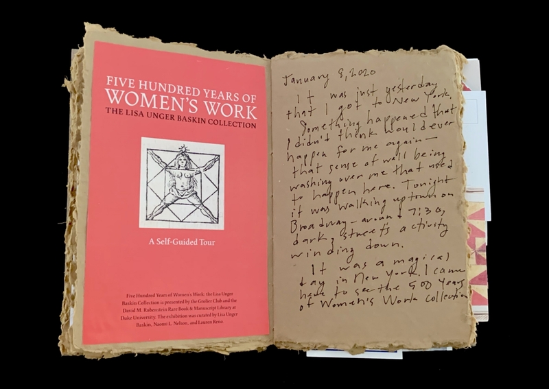 Open book with a red left page titled "Five Hundred Years of Women's Work" and handwritten text on the right page.