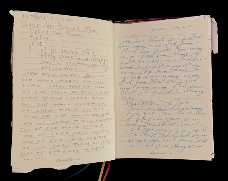 Open journal with handwritten text about mercy from Jesus Christ.