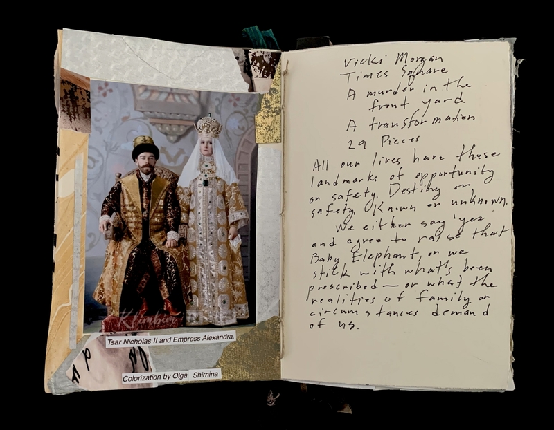 An open notebook with a photo of Tsar Nicholas II and Empress Alexandra on the left page and handwritten text on the right page.
