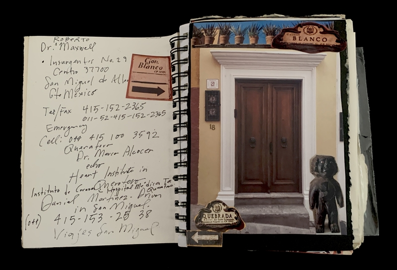 A handwritten note and a photograph of a building entrance are displayed in a spiral-bound notebook.