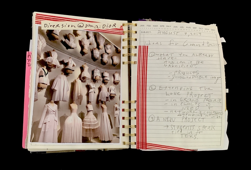 A notebook page featuring a photograph of Dior dresses and handwritten notes about a project.