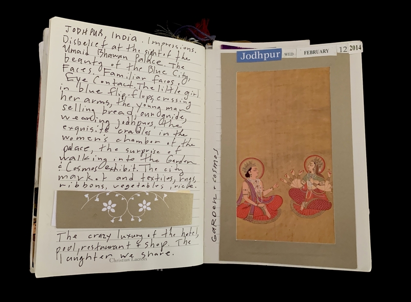 Open journal with handwritten notes about Jodhpur, India, and an illustration of two traditional figures.