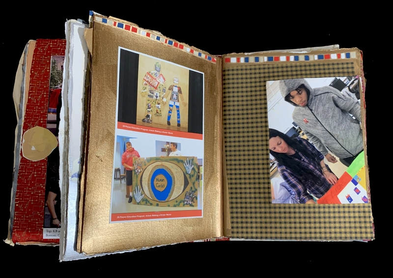 Open scrapbook with gold and checkered backgrounds, featuring photos of an art program and two individuals working on a project.