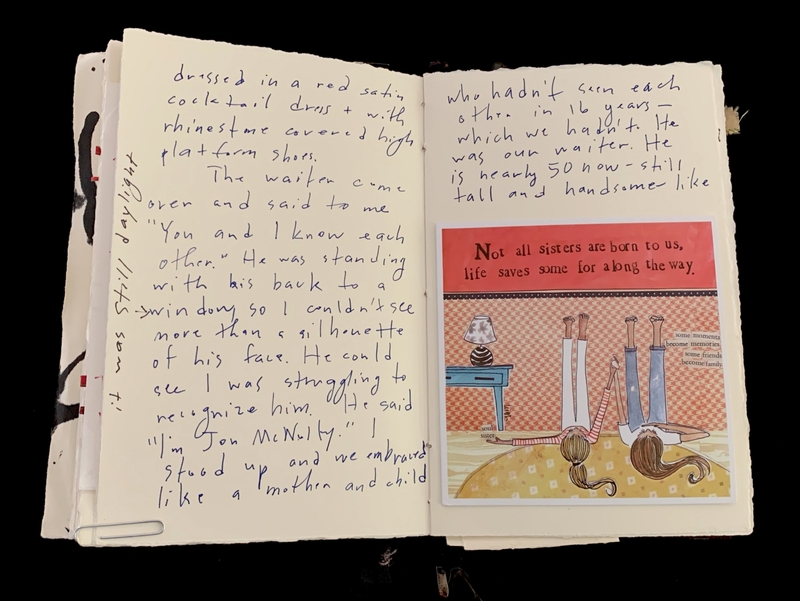 Open notebook with handwritten text and an illustration with printed text.
