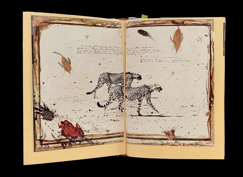 A page from a sketchbook featuring a detailed illustration of two cheetahs with various doodles and text around them.