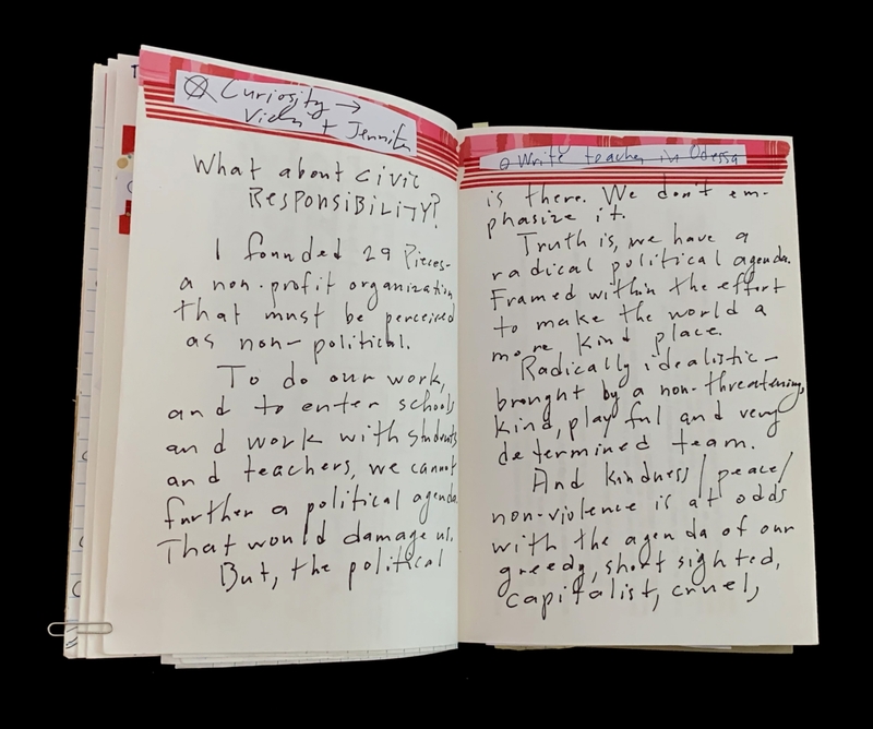 Open notebook with handwritten notes about civic responsibility and non-profit work.