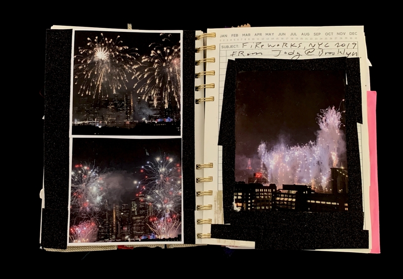A scrapbook page featuring photographs of fireworks over a cityscape, labeled "Fireworks, NYC 2019" from Jody @ Brooklyn.