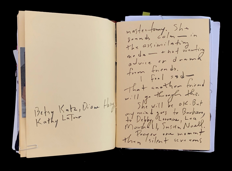 A handwritten note in a journal with names and a message about mastectomy.