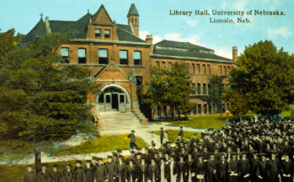 Postcard view of Library with graduates. View Image