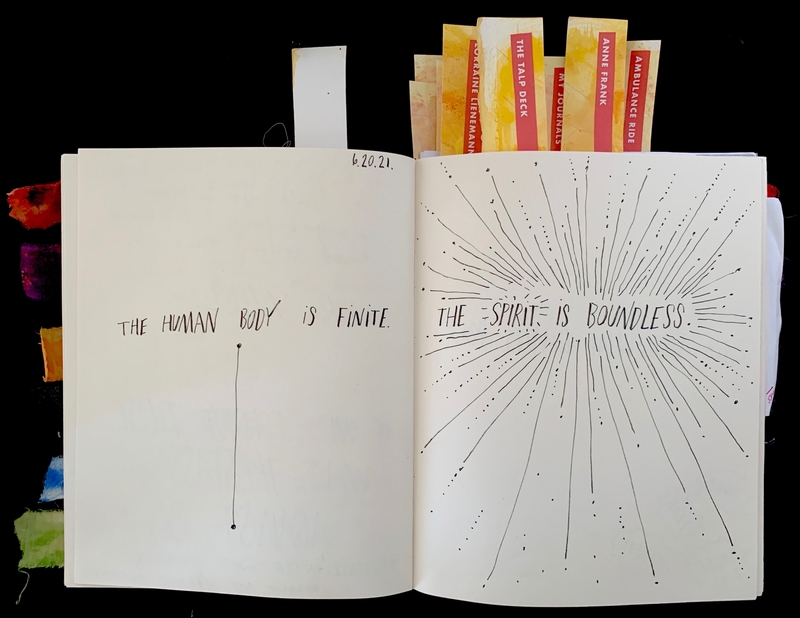 Open journal with handwritten text: "THE HUMAN BODY IS FINITE" and "THE SPIRIT IS BOUNDLESS," dated 6.20.21.