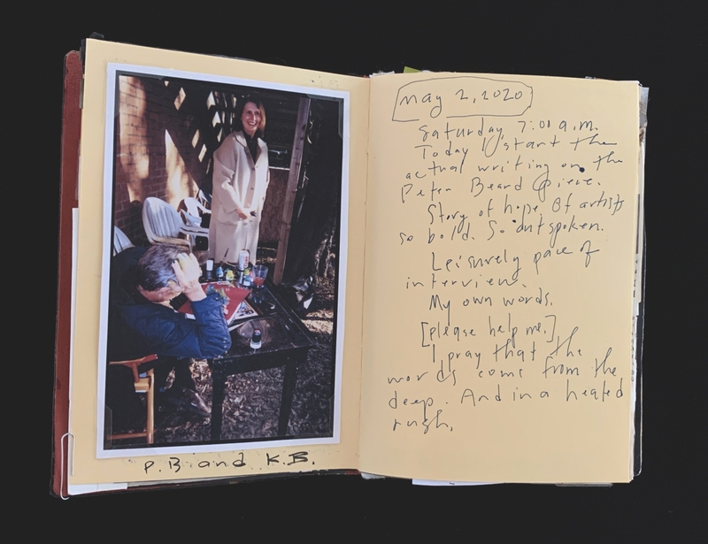 A handwritten journal entry dated May 2, 2020, with a photograph of two individuals, one seated and one standing, in a rustic setting.