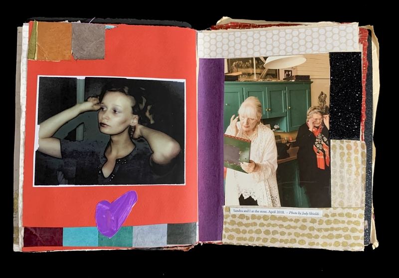 Open scrapbook showing a person adjusting their hair on the left page and two elderly women by a green cabinet on the right.