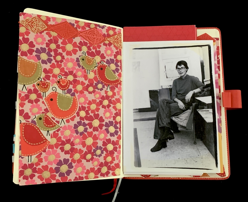 An open notebook with a colorful floral and bird pattern on the left and a black and white photo on the right.