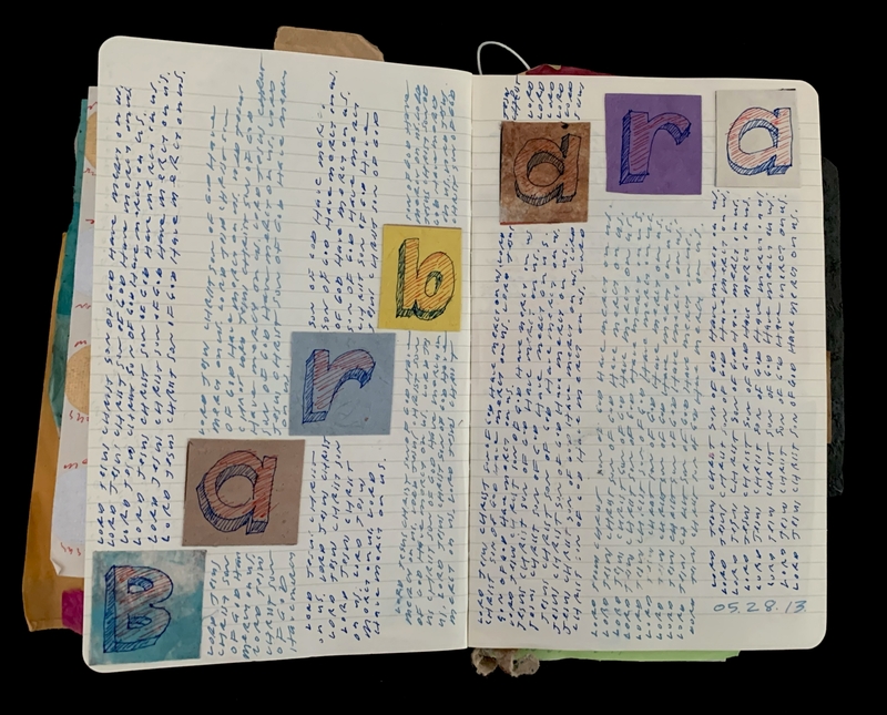 Open notebook with dense handwritten text and colorful squares spelling "Barbara".
