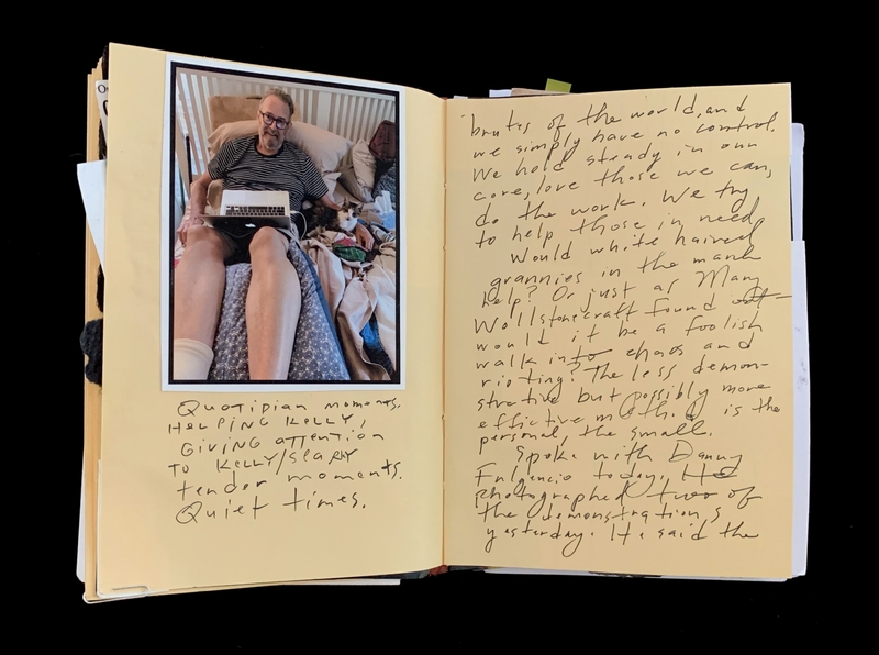 A handwritten journal page featuring a photograph of a person sitting on a bed with a laptop, accompanied by reflective notes and a small photograph of a dog.