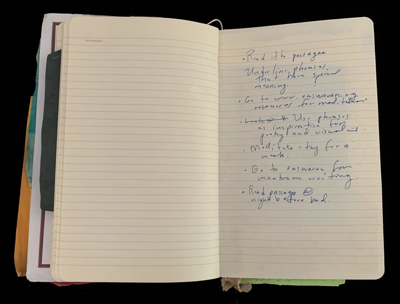 Open notebook with handwritten notes on the right page and blank lines on the left page.