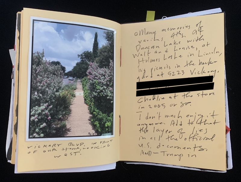 A handwritten page with a photograph of a garden path and some text.