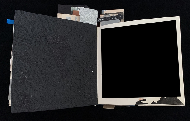 Open scrapbook with textured black left page and white-bordered right page. Various paper scraps protrude, one labeled "COMMITMENT."