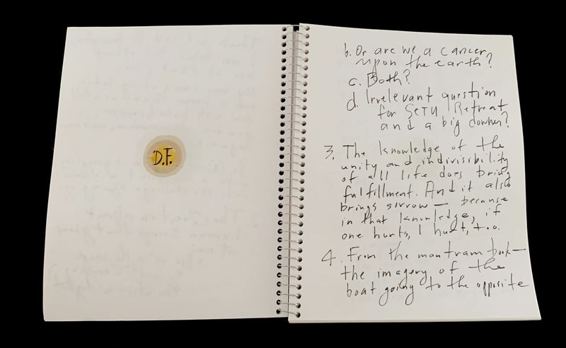 A handwritten page with a circular sticker and some text entries.