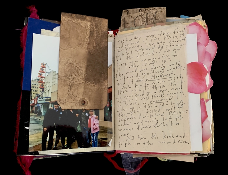 A scrapbook page featuring a photograph, handwritten notes, and decorative elements.